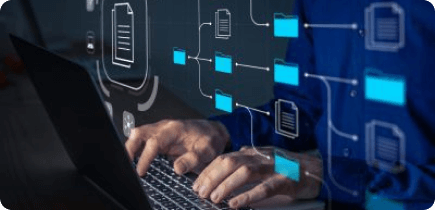 A man is typing on a laptop computer.