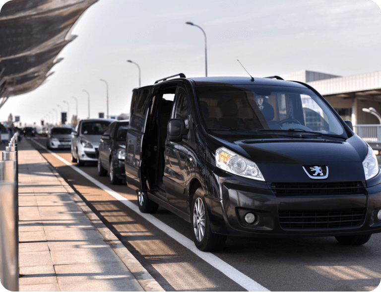 A van is parked on the side of the road.